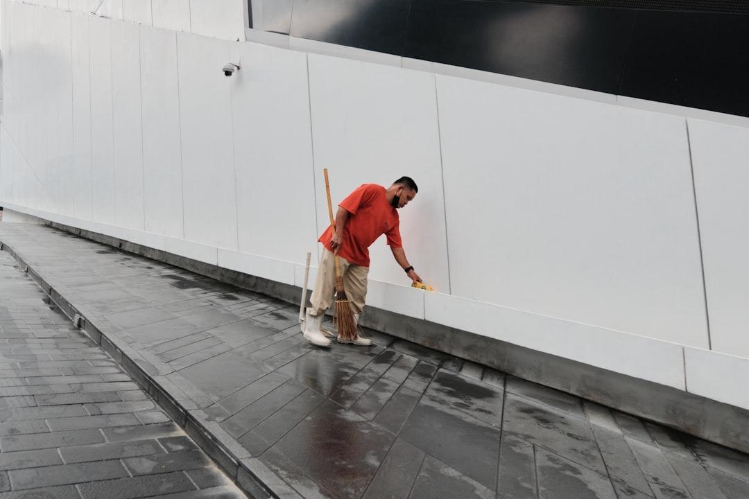 Home improvement team painting a deck